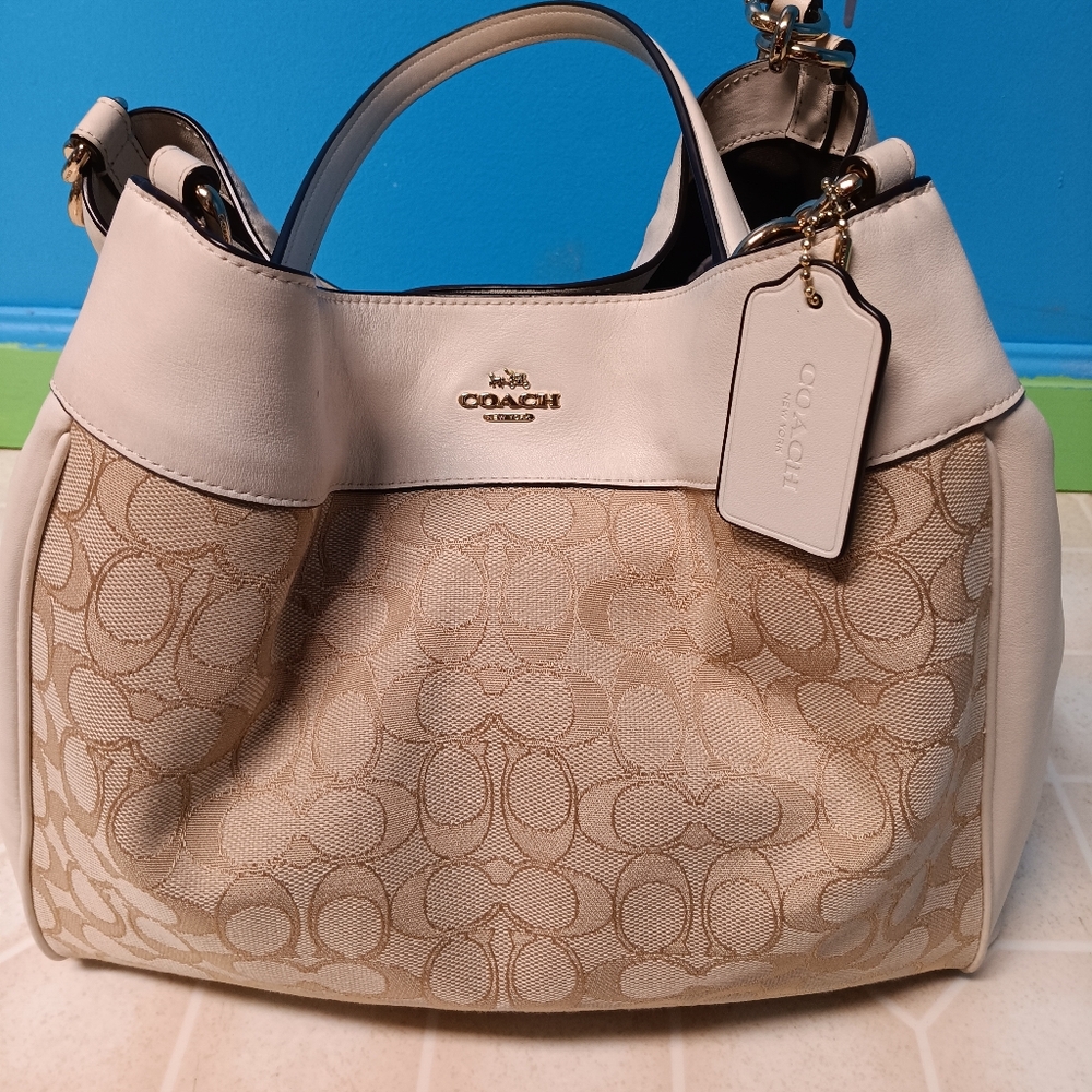Vintage Coach bag brand new. Coach leather cleaner included.